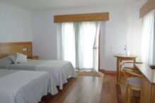 Guest House Comodoro Schlafzimmer